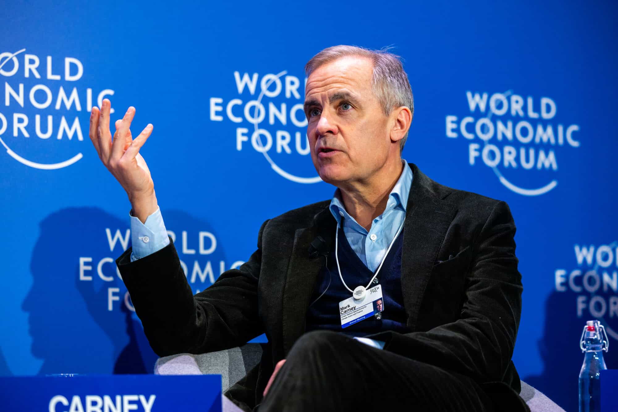 Mark Carney presenting at the 2023 World Economic Forum.