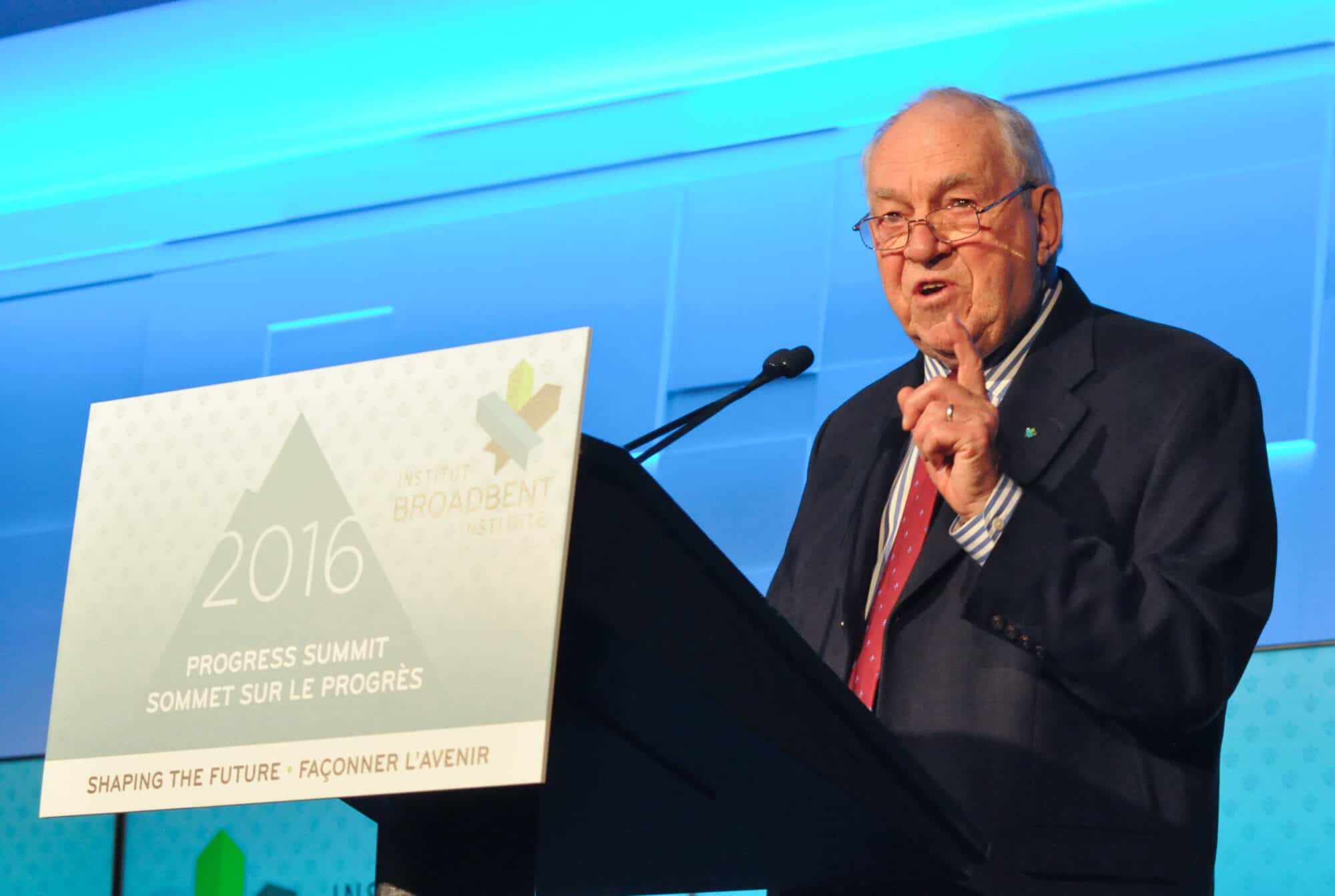 Ed Broadbent speaks from a podium delivering keynote remarks at the Broadbent Institute's 2016 Progress Summit in Ottawa.