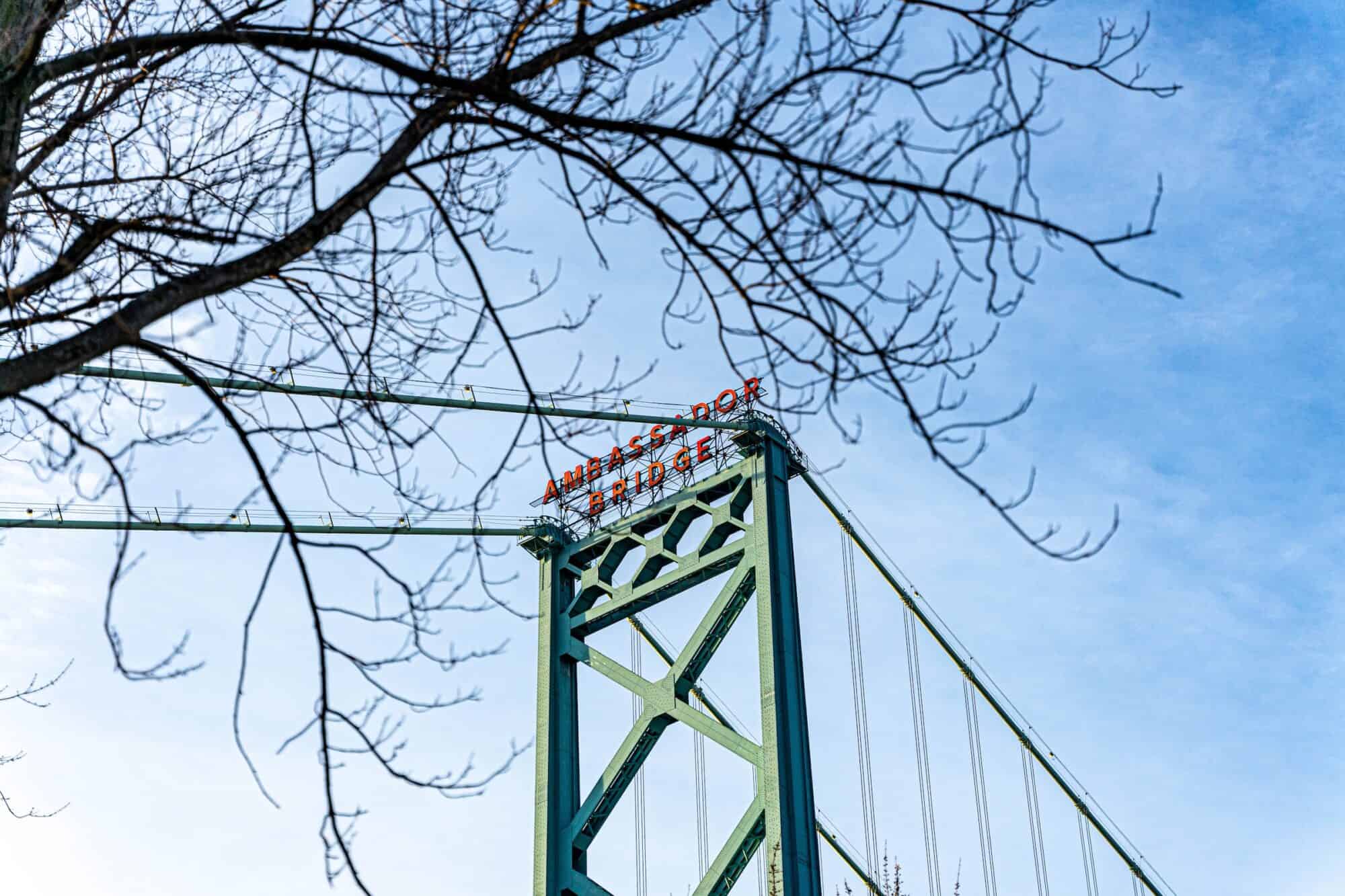 Photo of the sign on top of the Ambassador Bridge between Detroit and Windsor.