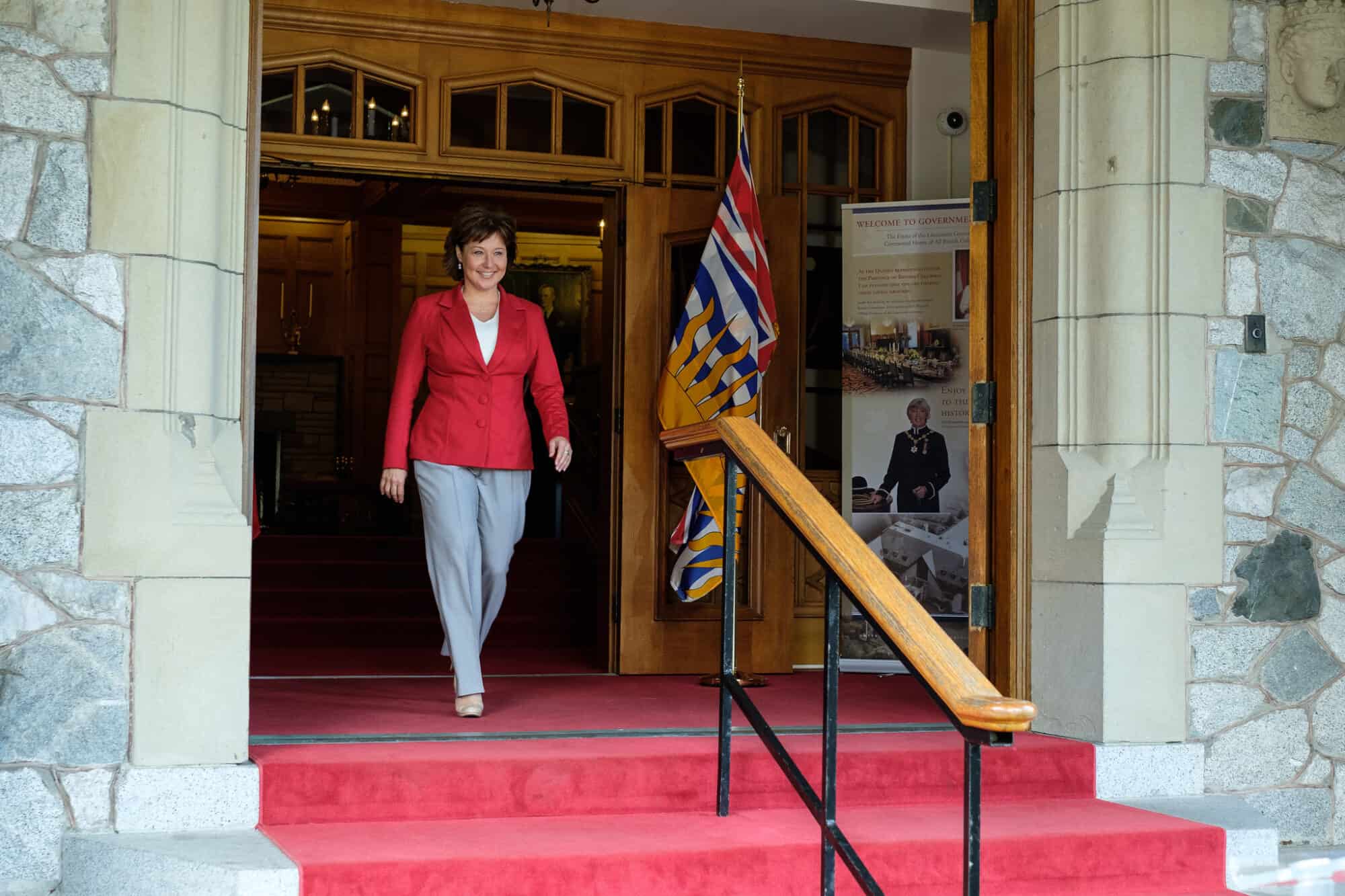 Christy Clark walks out of the front door of the BC Legislature.