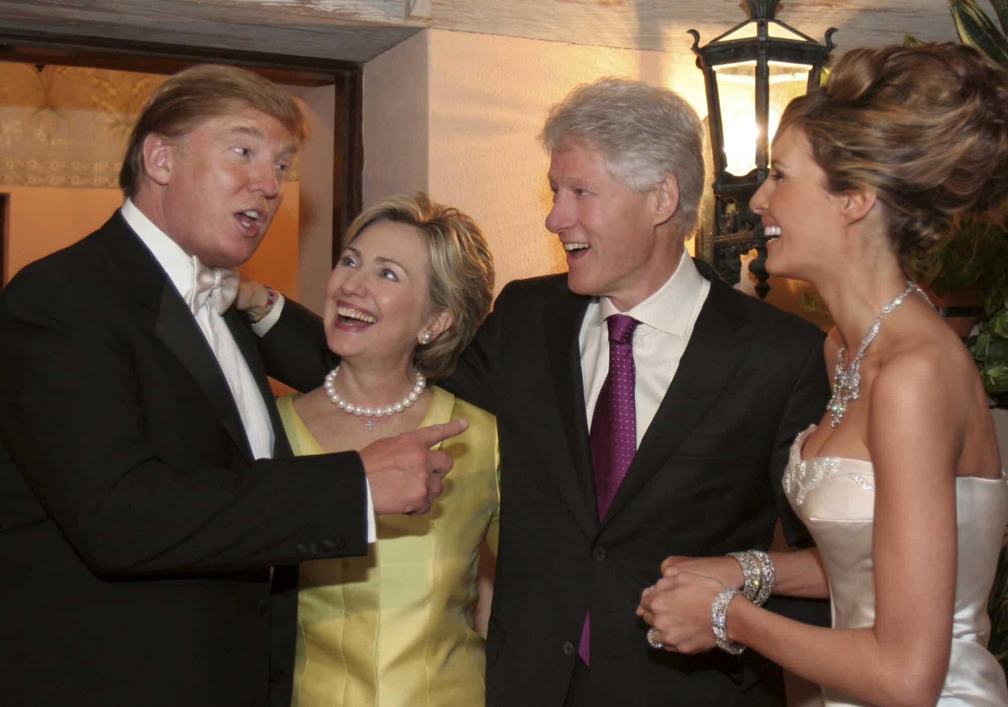 Donald and Melania Trump socialize with Hilary and Bill Clinton.