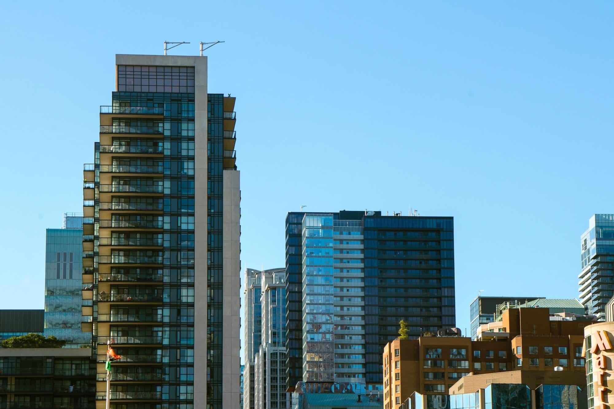 A skyline of different condo and apartment buildings in downtown Toronto, ON.